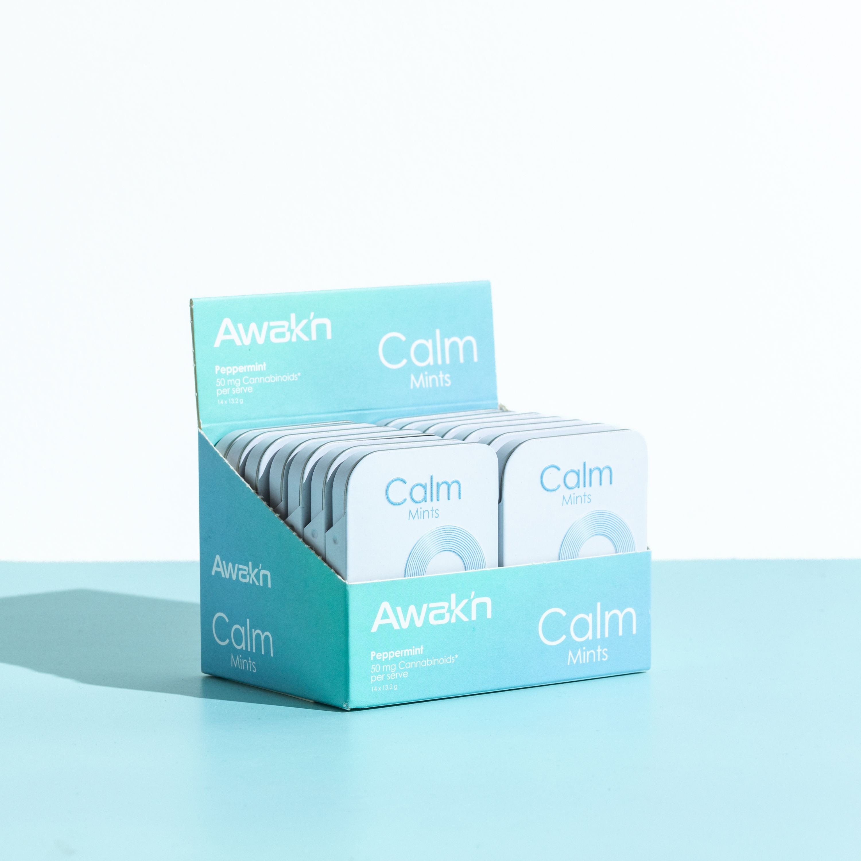 A box of Awak'n Calm Mints placed on a blue background